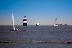 Various Boats Surrounding Peck's Ledge Light in Connecticut